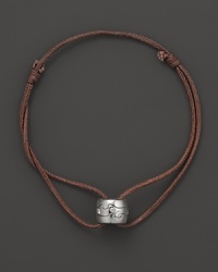 A white gold pendant scattered with diamonds accents this modern leather cord bracelet from Georg Jensen. A white gold pendant scattered with diamonds accents this modern leather cord bracelet from Georg Jensen.