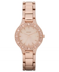 The picture of feminine grace, this rosy watch from DKNY glitters with pretty crystal accents. The picture of feminine grace, this rosy watch from DKNY glitters with pretty crystal accents.
