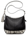 Class with sass. A classic silhouette gets an edgy upgrade with sleek python print detailing that adds just the right amount of attitude. Luxe leather is accented with gleaming silver-tone hardware, signature embossed key chain and detail stitching, while plenty of pockets inside and out offer effortless organization.
