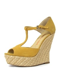 A T-strap vamp exudes feminine charm, courtesy of Luxury Rebel. Finished in soft suede and a raffia wedge, the Carol wedge is subtle yet statement-making. A T-strap vamp exudes feminine charm, courtesy of Luxury Rebel. Finished in soft suede and a raffia wedge, the Carol wedge is subtle yet statement-making.