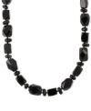 Bold in black. This sterling silver necklace features onyx (8-20 mm) stones in a variety of shapes for a stylish touch. Approximate length: 24 inches.
