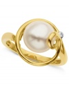 Elegant and appealing. This ring, crafted from 14k gold, features a cultured freshwater pearl (9 mm) with a diamond accent for subtle, yet stylish, touch. Approximate diameter: 3/4 inch.