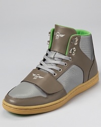 Contrasting nylon and leather panels put a cool spin this retro high top from Creative Recreation. Contrasting nylon and leather panels put a cool spin this retro high top from Creative Recreation.