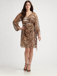 Take a walk on the wild side with this animal-print dress featuring a seductive neckline. Its airy sleeves provide alluring arm coverage.Crossover topThree-quarter sleevesAllover printConcealed back zipperFully linedAbout 24 from natural waistPolyesterDry cleanImported of Italian fabric Take a walk on the wild side with this animal-print dress featuring a seductive neckline. Its airy sleeves provide alluring arm coverage.Crossover topThree-quarter sleevesAllover printConcealed back zipperFully linedAbout 24 from natural waistPolyesterDry cleanImported of Italian fabric
