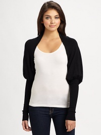 A chic, structured mutton sleeve lends unique style to this lightweight knit shrug.Open frontMutton sleeves with extra long cuffsAbout 10 from shoulder to hem80% rayon/20% nylonDry cleanImported