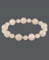 Slip-on style for instant sophistication. Polished rose quartz beads (122-3/8 ct. t.w.) comprise this beautiful stretch style. Set in sterling silver. Approximate length: 7-1/2 inches.