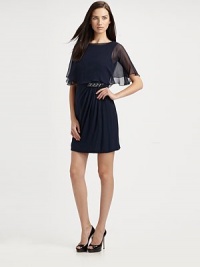 A classic shift, made elegant by asymmetrical ruching, jewel details, and an airy, sheer capelet overlay.Sleeveless Attached sheer capelet with back hook closure Ruched side drape with jeweled detail V back with concealed back zip About 21 from natural waist Fully Lined Silk Dry Clean Imported A classic shift, made elegant by asymmetrical ruching, jewel details, and an airy, sheer capelet overlay.Sleeveless Attached sheer capelet with back hook closure Ruched side drape with jeweled detail V back with concealed back zip About 21 from natural waist Fully Lined Silk Dry Clean Imported
