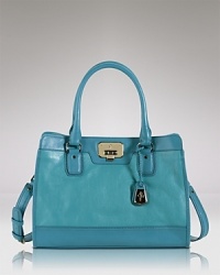 Classically styled yet designed for the modern day woman. Cole Haan's leather tote doesn't disappoint with room for the essentials, bold hardware, and an ever-chic look. Classically styled yet designed for the modern day woman. Cole Haan's leather tote doesn't disappoint with room for the essentials, bold hardware, and an ever-chic look.