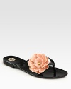 An oversized, dimensional flower blossoms on this durable PVC essential. PVC upperRubber soleImported