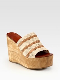 Artfully crafted woven leather upper joined by an earthy wooden wedge and platform. Wooden wedge, 4 (100mm)Wooden platform, 2 (50mm)Compares to a 2 heel (50mm)Woven leather upperLeather liningRubber soleImported Artfully crafted woven leather upper joined by an earthy wooden wedge and platform. Wooden wedge, 4 (100mm)Wooden platform, 2 (50mm)Compares to a 2 heel (50mm)Woven leather upperLeather liningRubber soleImported