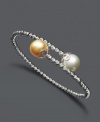 Wrap your wrists in elegant style. Bracelet features a wrapped cuff design with cultured Golden South Sea pearls (9-10 mm) at the ends and sparkle bead accents. Crafted in sterling silver. Approximate length: 7-1/2 inches.