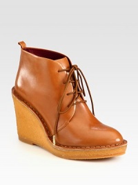 Comfort and style combine in this elevated silhouette of ultra-soft leather with a lace-up front. Rubber wedge, 4 (100mm)Rubber platform, ¾ (20mm)Compares to a 3¼ heel (80mm)Leather upperLeather liningRubber trek solePadded insoleImported Comfort and style combine in this elevated silhouette of ultra-soft leather with a lace-up front. Rubber wedge, 4 (100mm)Rubber platform, ¾ (20mm)Compares to a 3¼ heel (80mm)Leather upperLeather liningRubber trek solePadded insoleImported