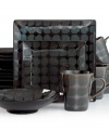 Anything but square, Gibson's Mythos dinnerware set is finished in a brilliant reactive glaze that ensures no two pieces are exactly alike. Its spotty design and dark palette make a bold statement in modern settings.