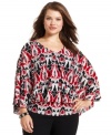 Liven up your neutral bottoms with Style&co.'s batwing sleeve plus size top, punctuated by banded hem. (Clearance)