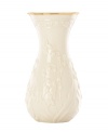 Lily of the valley springs from ivory porcelain, giving this Lenox Floral Meadow vase a delightfully understated grace. A band of sumptuous gold adds to its classic allure.