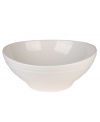Evoking the natural exuberance of thrown pottery, the Mikasa Swirl vegetable bowl brings unfussy elegance to your table in classic stoneware. Vegetable bowl not shown.