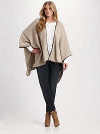 Classic cool-weather essential with oversized poncho sleeves, faux leather trim and an asymmetrical hem. Open front Poncho sleeves Asymmetrical hem Faux leather trim 37% wool/30% viscose/20% nylon/8% angora/5% cashmere Hand wash Made in Italy Classic cool-weather essential with oversized poncho sleeves, faux leather trim and an asymmetrical hem. Open front Poncho sleeves Asymmetrical hem Faux leather trim 37% wool/30% viscose/20% nylon/8% angora/5% cashmere Hand wash Made in Italy