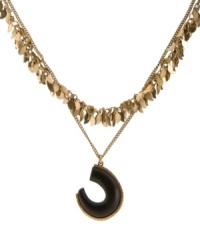 A striking statement maker. Lucky Brand's double strand necklace incorporates a natural wood tusk with gold tone accents. Crafted in gold tone mixed metal. Approximate length: 18 inches + 2-inch extender. Approximate drop: 2-1/2 inches. A striking statement maker. Lucky Brand's double strand necklace incorporates a natural wood tusk with gold tone accents. Crafted in gold tone mixed metal. Approximate length: 18 inches + 2-inch extender. Approximate drop: 2-1/2 inches.