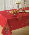 With a rich red hue and daintily scalloped edges, this Lenox tablecloth puts a festive, feminine touch on wintertime tables. Swirling ribbons and sprigs of holly set the scene for delectable Christmas dining.