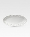 An elegantly detailed serving platter is made entirely by hand in fine Limoges porcelain with a raised pearl detail. From the Perlee White Collection Porcelain 14 X 7 Dishwasher safe Imported 