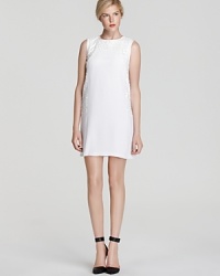Shimmer into the spotlight with this event-smart sleeveless dress embellished with tonal sequins and a subtly sexy keyhole cutout at the back. Shimmer into the spotlight with this event-smart sleeveless dress embellished with tonal sequins and a subtly sexy keyhole cutout at the back.