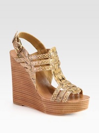 An ultra-high stacked wedge elevates this seasonal favorite, rendered in woven snake-print leather. Stacked wedge, 4¾ (120mm)Stacked platform, 1¼ (30mm)Compares to a 3½ heel (90mm)Snake-print leather upperAdjustable ankle strapLeather lining and solePadded insoleImported An ultra-high stacked wedge elevates this seasonal favorite, rendered in woven snake-print leather. Stacked wedge, 4¾ (120mm)Stacked platform, 1¼ (30mm)Compares to a 3½ heel (90mm)Snake-print leather upperAdjustable ankle strapLeather lining and solePadded insoleImported