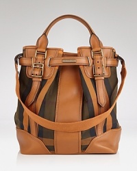 Burberry's signature check is refreshed for this season in a day-right shape and contrasting leather accents. Slouchy and sophisticated, this tote flaunts a modern ease that's ideal for the busiest of days. Burberry's signature check is refreshed for this season in a day-right shape and contrasting leather accents. Slouchy and sophisticated, this tote flaunts a modern ease that's ideal for the busiest of days.