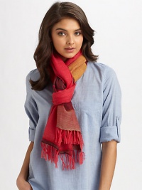 A semi-sheer, woven wrap in a colorblocked design with fringe trim.90% merino wool/10% acrylic80 X 26Hand washImported