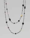 This delicately long design features garnet, hematite, black onyx and 18k gold station beads in various sizes and shapes. Garnet, hematite, black onyx and 18k gold beadsBlacked sterling silverLength, about 36Slip-on styleImported 