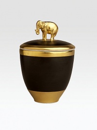 A candle with the intoxicating scent of pink champagne, encased in handcrafted, fine Limoges porcelain with 14k goldplated accents. Includes a fitted lid with a clasp sculpted in the shape of an elephant on an island of 14k gold. Handcrafted porcelain 5½H X 5 diam. Imported 