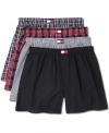 A four-pack wardrobe of cotton boxer shorts, here done in a palette of blacks and reds, from Tommy Hilfiger.