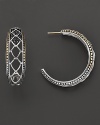 An elegant offering from John Hardy, the Naga hoop earring blends gold and silver, rendered with filigree cutout detail. Designed by John Hardy.