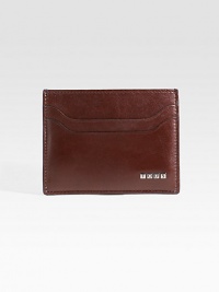 EXCLUSIVELY AT SAKS. A sophisticated option to the bulky wallet, designed in smooth leather with metal logo detail. Top-loading currency pocket Two card slots 4 X 3 Made in Italy 