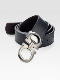 Black on one side and hickory on the other, this reversible belt crafted in smooth Italian leather with double gancini buckle, will be a stylish, versatile addition to your existing wardrobe.LeatherAbout 1½ wideMade in Italy