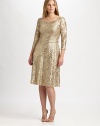 Shimmer and shine, a stunning style featuring a gorgeous metallic lace and allover sequins. Round neckThree-quarter sleevesAllover beadingConcealed back zipperFully linedAbout 23 from natural waist70% polyester/30% metallic threadDry cleanMade in USA of imported fabric