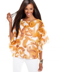 The swirling print of INC's petite top accents the fluidly-draped silhouette. Pair it with fitted jeans or capris to balance the look. The swirling print of INC's petite top accents the fluidly-draped silhouette. Pair it with fitted jeans or capris to balance the look.
