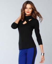 Cool cutouts put s new twist on the classic petite turtleneck, from INC.