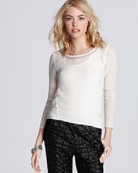Tonal dots and silver beads add texture and style to this ethereal-looking Free People sweater, rendered in a lush wool blend. Tonal dots and silver beads add texture and style to this ethereal-looking Free People sweater, rendered in a lush wool blend.