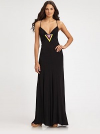 A stunning display of beads and ruching complete the elegant bodice of this maxi design. Plunging v-necklineSpaghetti strapsBeaded, ruched centerTie back with beaded detailsBack zipper95% modal/5% spandexHand washMade in USA of imported A stunning display of beads and ruching complete the elegant bodice of this maxi design. Plunging v-necklineSpaghetti strapsBeaded, ruched centerTie back with beaded detailsBack zipper95% modal/5% spandexHand washMade in USA of imported