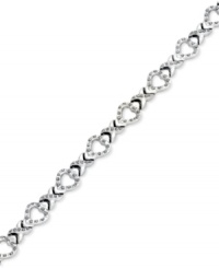 An excellent selection. This X link bracelet is crafted from platinum over sterling silver with diamond accents giving it a lustrous touch. Approximate length: 7-1/2 inches. Approximate width: 3/8 inch. An excellent selection. This X link bracelet is crafted from platinum over sterling silver with diamond accents giving it a lustrous touch. Approximate length: 7-1/2 inches. Approximate width: 3/8 inch.