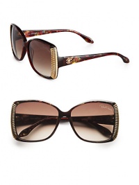 Get noticed in these glamorous printed frames with ridged metal accents. Available in black melange grey/dark ruthenium with smoke gradient lens or light brown melange gold/light bronze with brown gradient lens. Logo temples100% UV protectionMade in Italy 