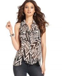 The mixed tribal-inspired print adds subtle safari style to this GUESS? blouse that's on trend for summer! The mixed tribal-inspired print adds subtle safari style to this GUESS? blouse that's on trend for summer!