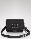 Glamor-girl brand Juicy Couture takes a practical approach to accessorizing with this nylon crossbody bag. Ideally sized for days on the go, it perfects easy-chic style.