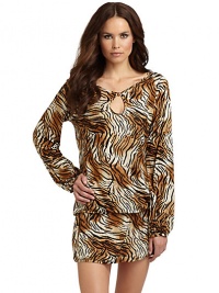THE LOOKTiger print, alloverLong sleeves with gathered detail at cuffsFront keyhole with button closureCinched detail at hem with drawstring tie closureTHE FITAbout 36 from shoulder to hemTHE MATERIALModalCARE & ORIGINHand washImported