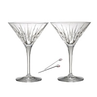 Roundly respected for its history of craftsmanship, Reed & Barton preserves its old-world heritage with sparkling designs that glimpse the future, as with the brilliantly contemporary cutting on these shimmering martini glasses, accompanied by olive picks for a fine complement to your barware collection.