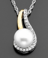 Gracefully draped round-cut diamond accents highlight a lovely cultured freshwater pearl (7 mm) on this beautiful pendant. Set in 14k gold & sterling silver. Approximate length: 18 inches. Approximate drop: 3/4 inches. Gracefully draped round-cut diamond accents highlight a lovely cultured freshwater pearl (7 mm) on this beautiful pendant. Set in 14k gold & sterling silver. Approximate length: 18 inches. Approximate drop: 3/4 inches.