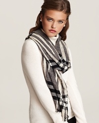 Burberry ups the glam factor with their soft check scarf in crinkled fabric with fringe trim. Let the signature pattern and luxurious proportions transform your look.