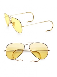 A sunny update to the classic aviator style, crafted in sleek, sophisticated metal with round temple tips. Available in gold with ambermatic lens.Metal temples100% UV protectionMade in Italy