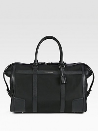 A handsome weekender that appeals to all of your travel needs, crafted in structured, all-purpose nylon with pebbled leather trim. Top zip closureTop handlesInterior zip pocketSide tab detailsProtective feet94% polyamide/6% acrylicFully lined 19½W x 12¼H x 10D Imported A handsome weekender that appeals to all of your travel needs, crafted in structured, all-purpose nylon with pebbled leather trim. Top zip closureTop handlesInterior zip pocketSide tab detailsProtective feet94% polyamide/6% acrylicFully lined 19½W x 12¼H x 10D Imported