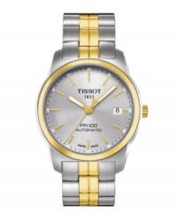 A shining example of self-winding excellence, Tissot's PR 100 watch is a double threat of casual and dress styling. Crafted of two tone stainless steel bracelet and round case with gold tone bezel. Silver tone dial features gold tone applied stick indices, minute track, date window at three o'clock, luminous three hands and logo. Swiss automatic movement. Water resistant to 100 meters. Two-year limited warranty. A shining example of self-winding excellence, Tissot's PR 100 watch is a double threat of casual and dress styling. Crafted of two tone stainless steel bracelet and round case with gold tone bezel. Silver tone dial features gold tone applied stick indices, minute track, date window at three o'clock, luminous three hands and logo. Swiss automatic movement. Water resistant to 100 meters. Two-year limited warranty.